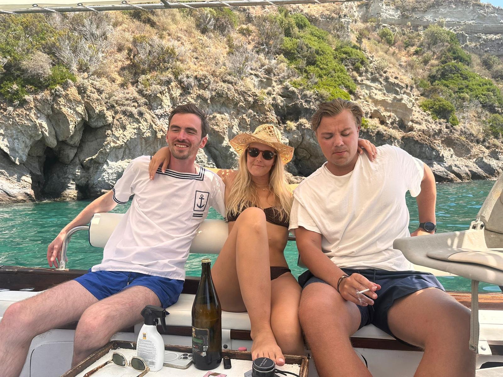 experiences boat tour around the island with stop at ischia port with ring hostel guest in Forio d'ischia